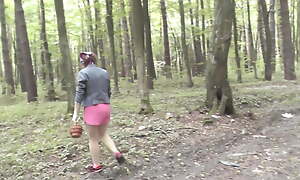 Mommy Milf walks without camiknickers in burnish apply forest, picks mushrooms.