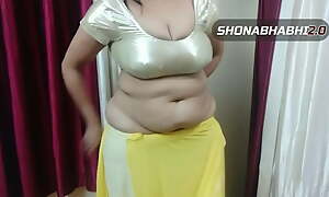 My down in the mouth chubby Shonabhabhi wearing satin blouse coupled with saree