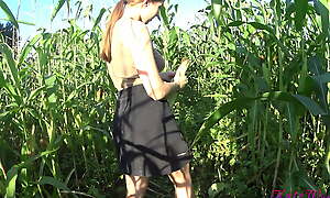 Kate Wood plays with her pussy in the air a cornfield