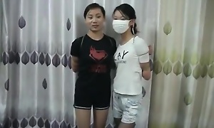 Four Chinese Girls Tied, One Wearing The religious ministry Mask